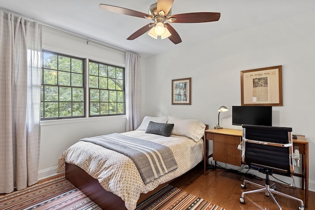 bedroom with wood-type flooring and ceiling fan