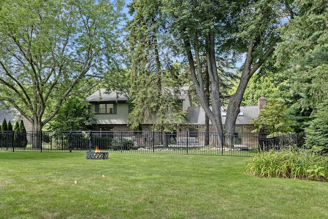 view of yard with an outdoor fire pit