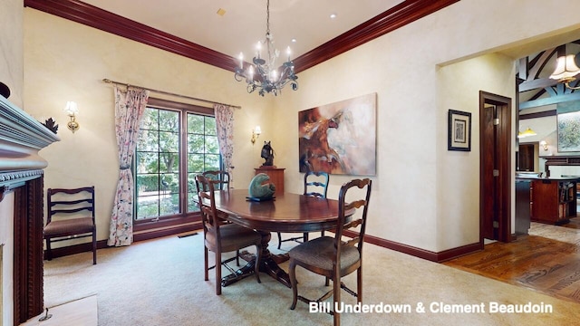 carpeted dining area with ornamental molding and a chandelier