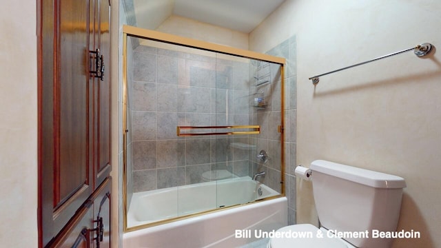 bathroom with enclosed tub / shower combo and toilet