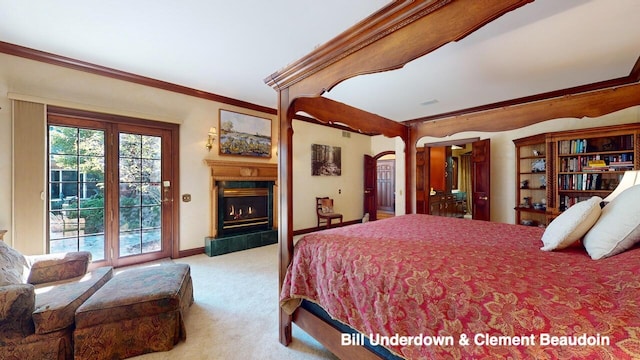 bedroom with a tiled fireplace, crown molding, light colored carpet, and access to exterior