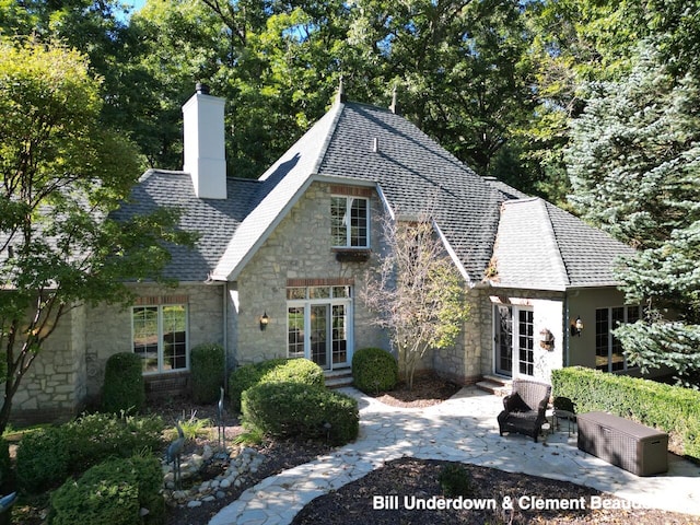 back of house with french doors and a patio