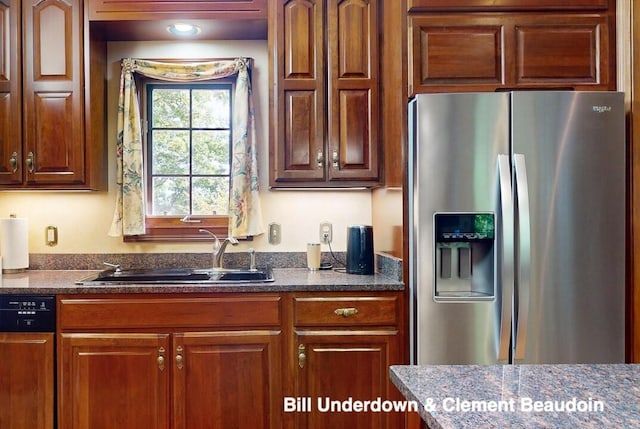 kitchen with stainless steel fridge, black dishwasher, and sink