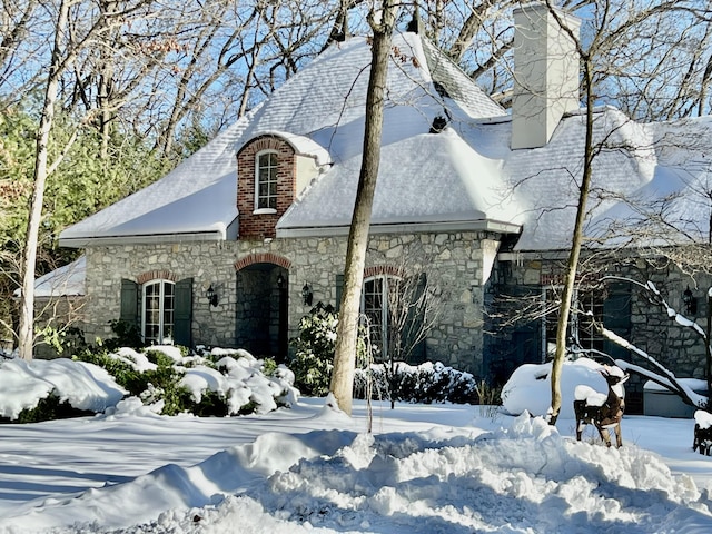 view of snow covered property