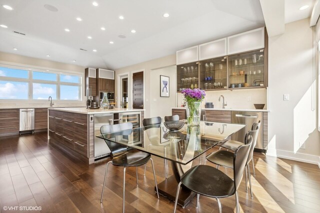 10 Peninsula Dr, New Buffalo, MI 49117 - dining room featuring dark wood finished floors, wine cooler, recessed lighting, and baseboards
