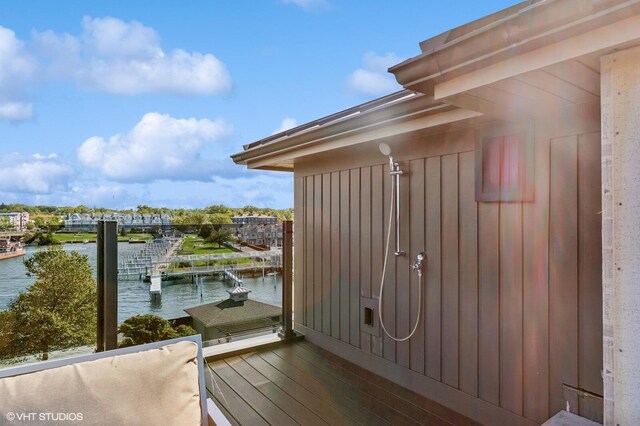 10 Peninsula Dr, New Buffalo, MI 49117 - wooden terrace featuring a water view and a dock