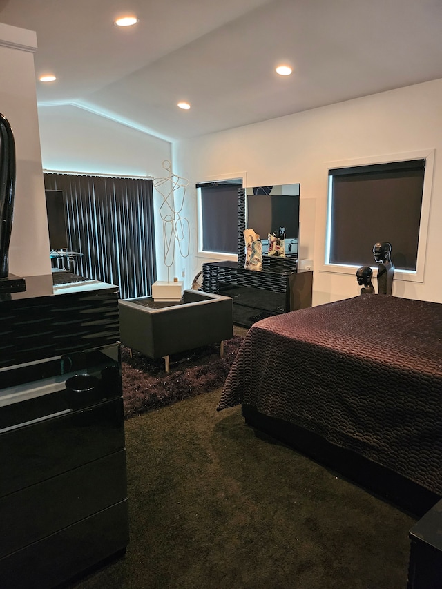 bedroom with carpet and vaulted ceiling