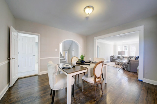 dining space featuring dark hardwood / wood-style floors