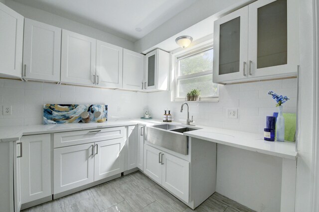17566 Monica St, Detroit, MI 48221 - kitchen with a sink, white cabinets, and backsplash