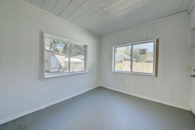 17566 Monica St, Detroit, MI 48221 - empty room featuring concrete flooring, plenty of natural light, and wood ceiling