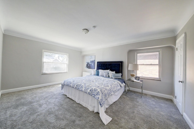 bedroom featuring crown molding, carpet flooring, and multiple windows