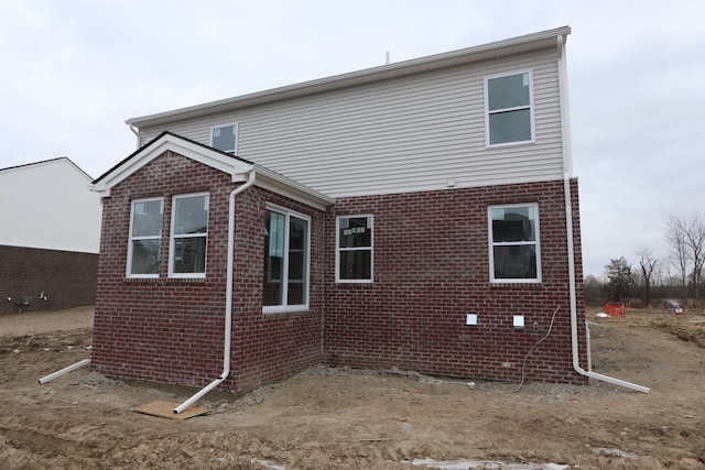 view of home's exterior featuring brick siding