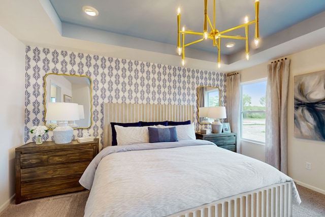 carpeted bedroom with wallpapered walls, a raised ceiling, and baseboards