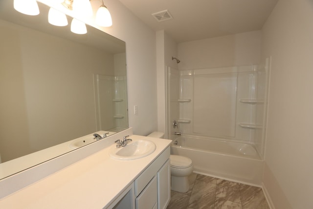 bathroom featuring visible vents, shower / washtub combination, toilet, marble finish floor, and vanity