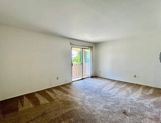 unfurnished room featuring carpet