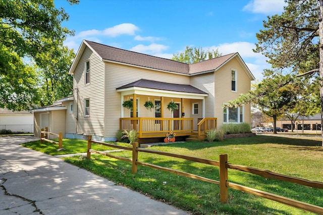 view of front of home featuring a front yard and a porch