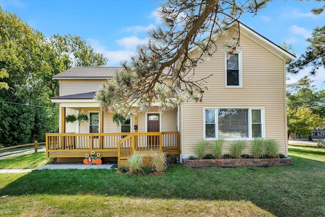 view of front facade featuring a porch and a front lawn