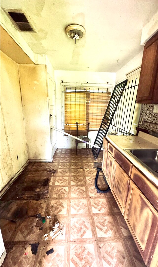 19685 Teppert St, Detroit, MI 48234 - kitchen featuring backsplash and a sink