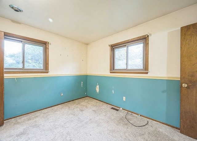 empty room with light colored carpet