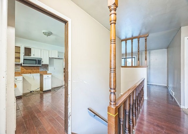 hallway featuring dark hardwood / wood-style flooring