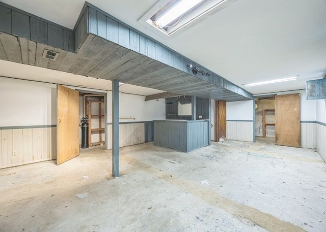 basement with wooden walls