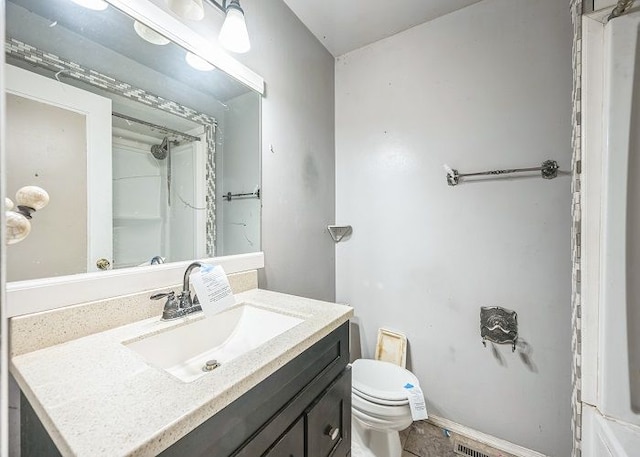 7178 Sherwood Ln, Davison, MI 48423 - bathroom with walk in shower, toilet, baseboards, and vanity