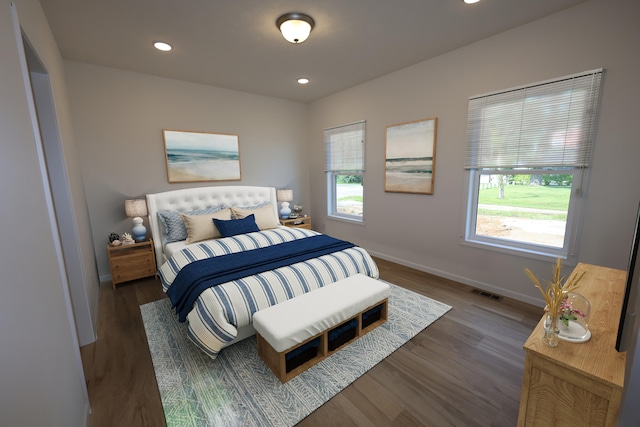 bedroom with dark wood-type flooring