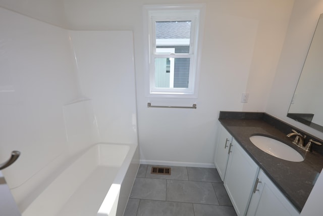 bathroom with vanity and tile patterned flooring