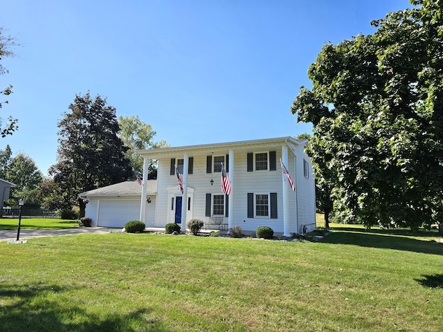 view of front of property with a front lawn and a garage