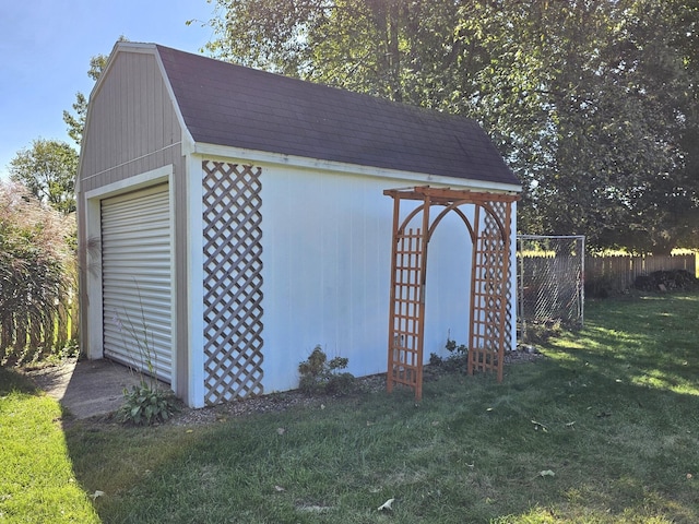 view of outbuilding featuring a yard