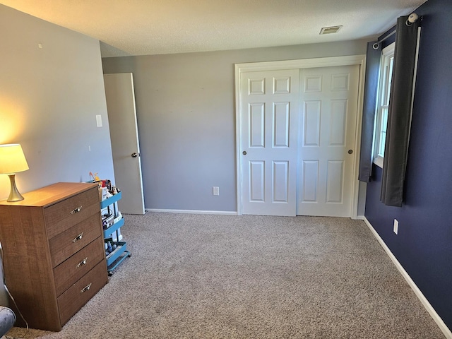 carpeted bedroom with a closet