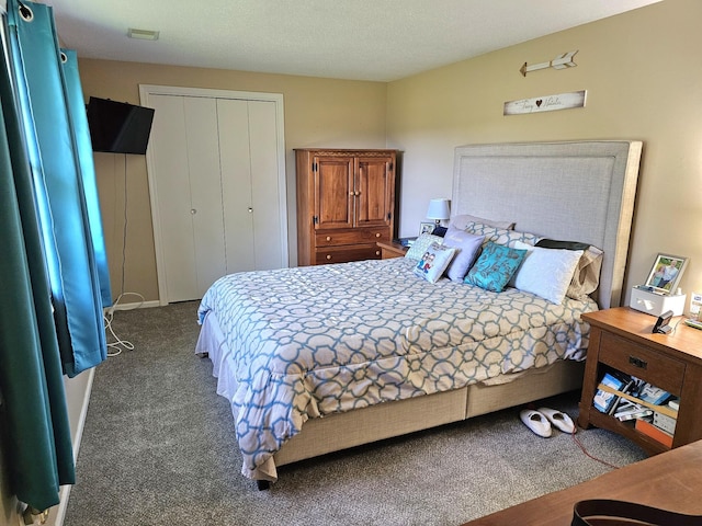 carpeted bedroom featuring a closet