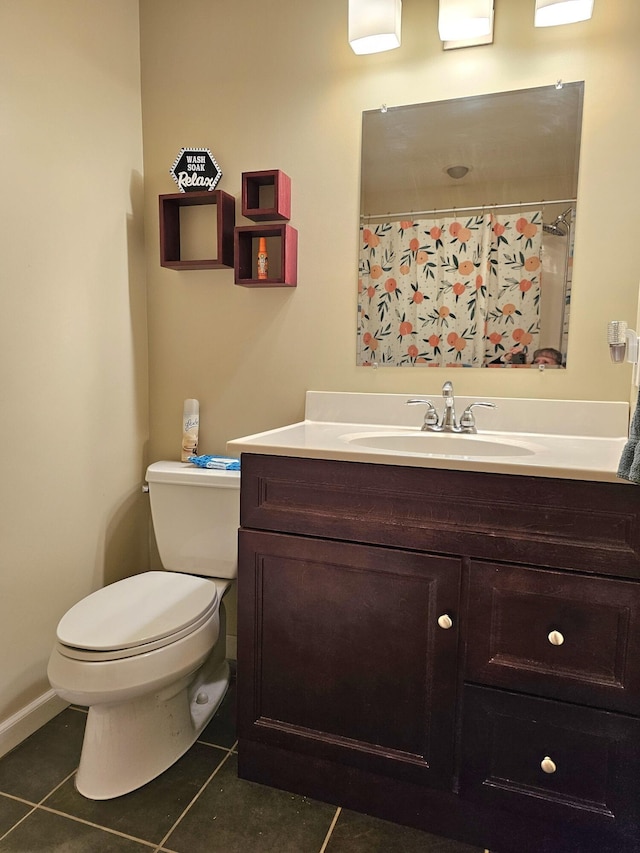 bathroom featuring tile patterned flooring, vanity, toilet, and a shower with curtain