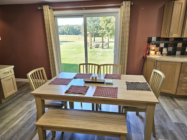 dining room with dark hardwood / wood-style flooring