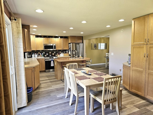 dining space featuring light hardwood / wood-style floors