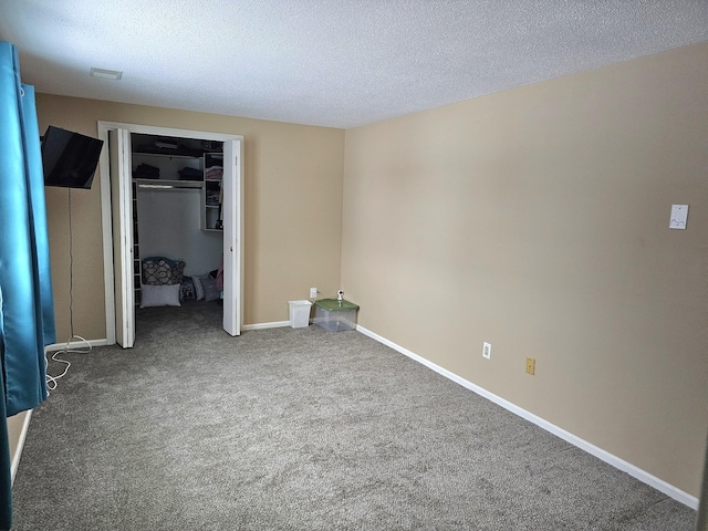 unfurnished bedroom with carpet flooring, a closet, and a textured ceiling