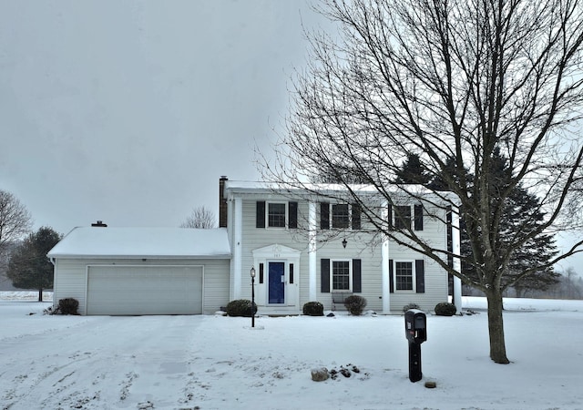 colonial house featuring a garage