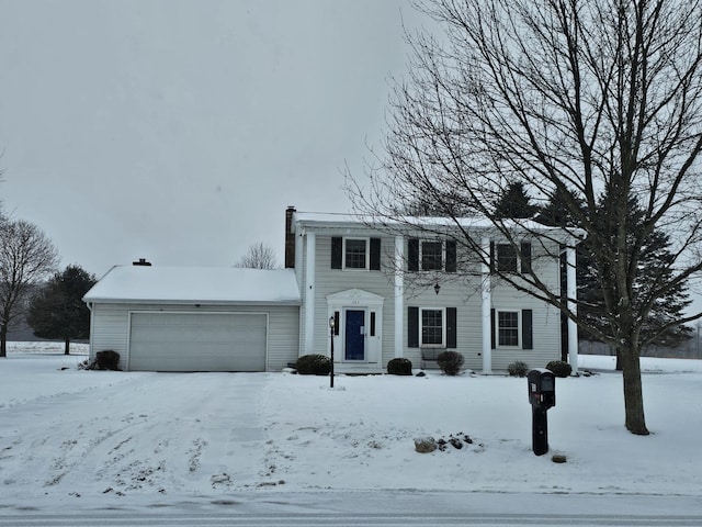 colonial-style house featuring a garage