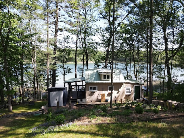 rear view of house with a water view