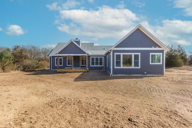 rear view of house with a porch