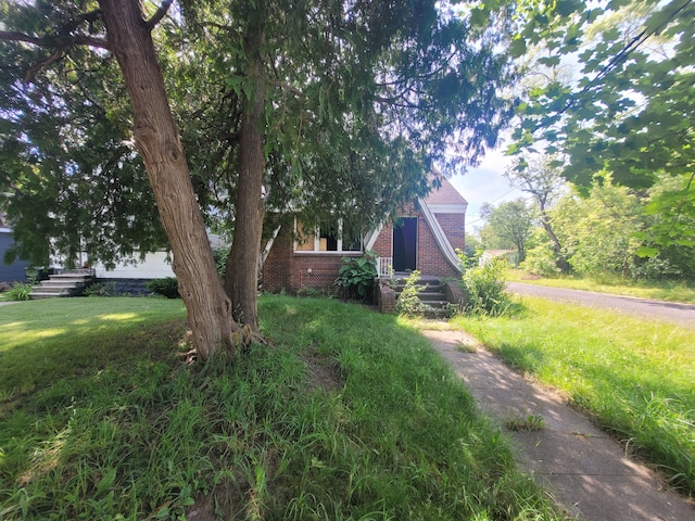 view of home's exterior with a lawn