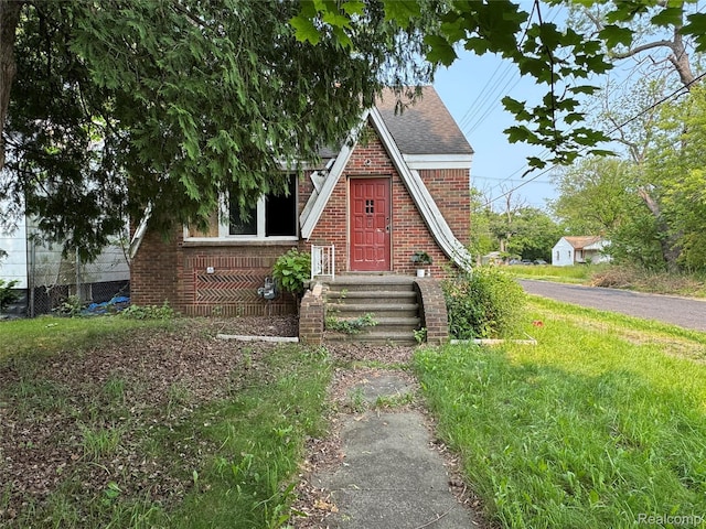 15379 Dolphin St, Detroit, MI 48223 - tudor home with brick siding and roof with shingles