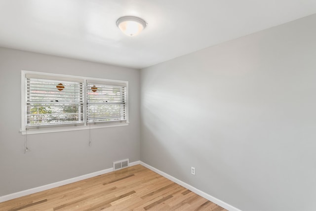 spare room with light hardwood / wood-style floors