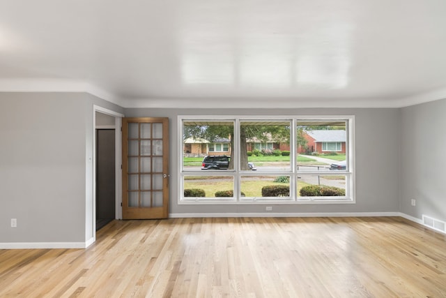 spare room with light wood-type flooring