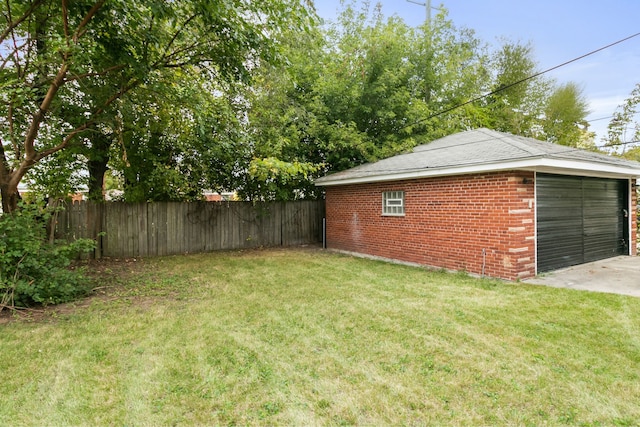 view of yard with an outbuilding and a garage