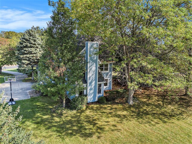 507 Lena Dr, South Haven, MI 49090 - view of property exterior featuring a yard and a chimney