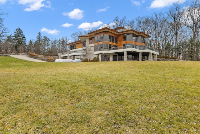 rear view of property featuring a yard