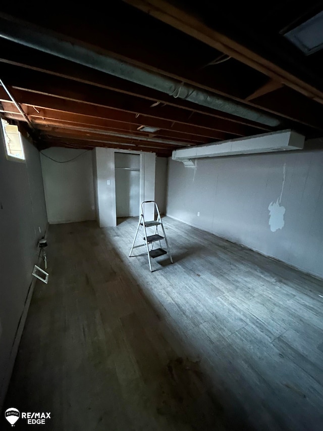 basement featuring hardwood / wood-style flooring