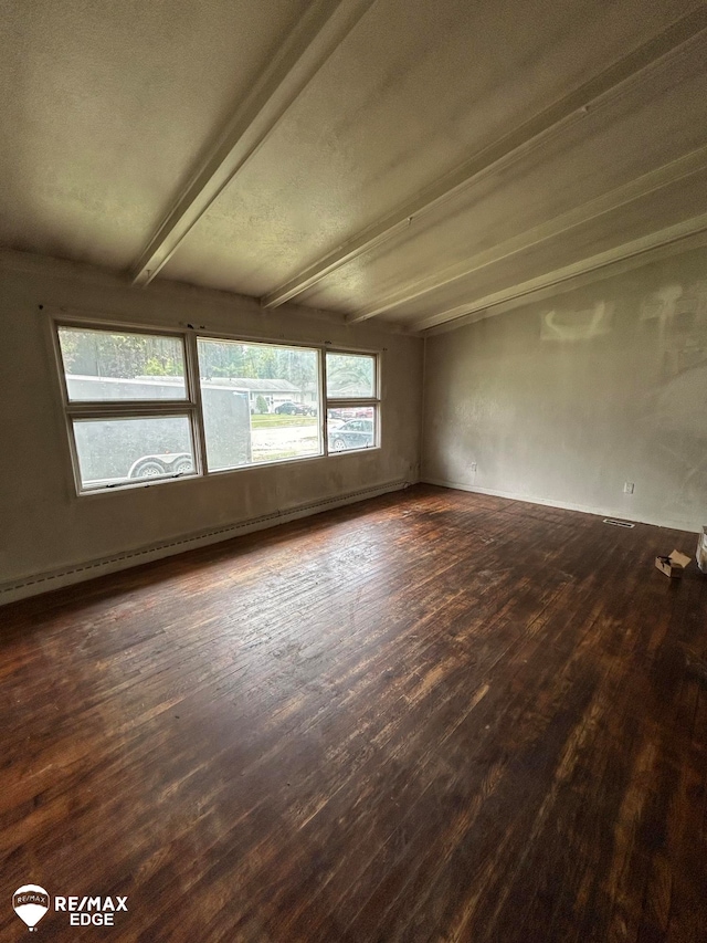 empty room featuring beamed ceiling, a textured ceiling, dark hardwood / wood-style floors, and a baseboard radiator