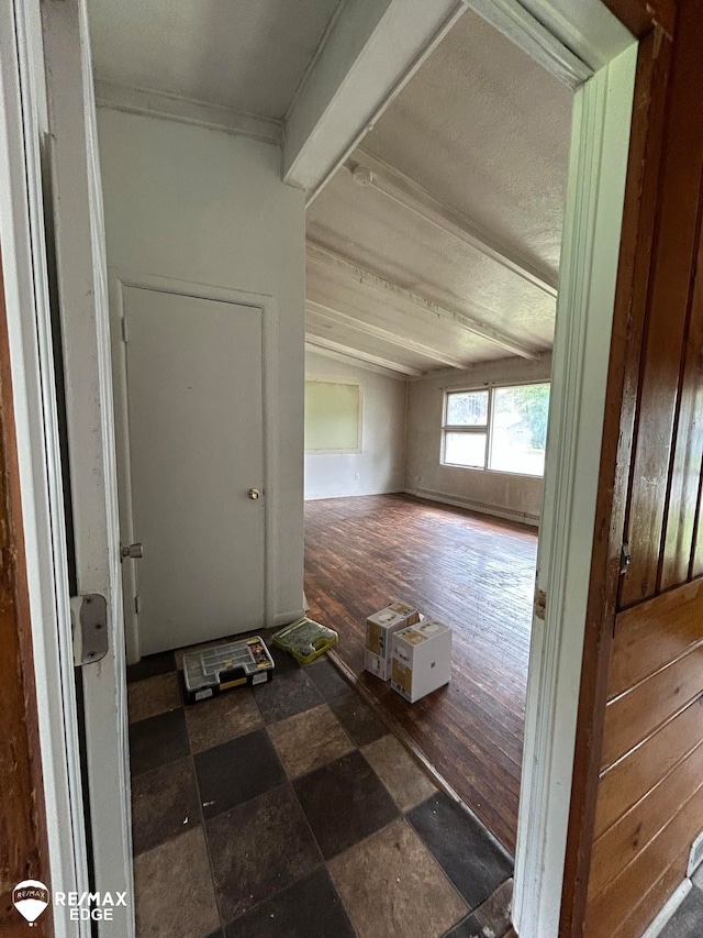 corridor featuring wood walls and dark hardwood / wood-style floors